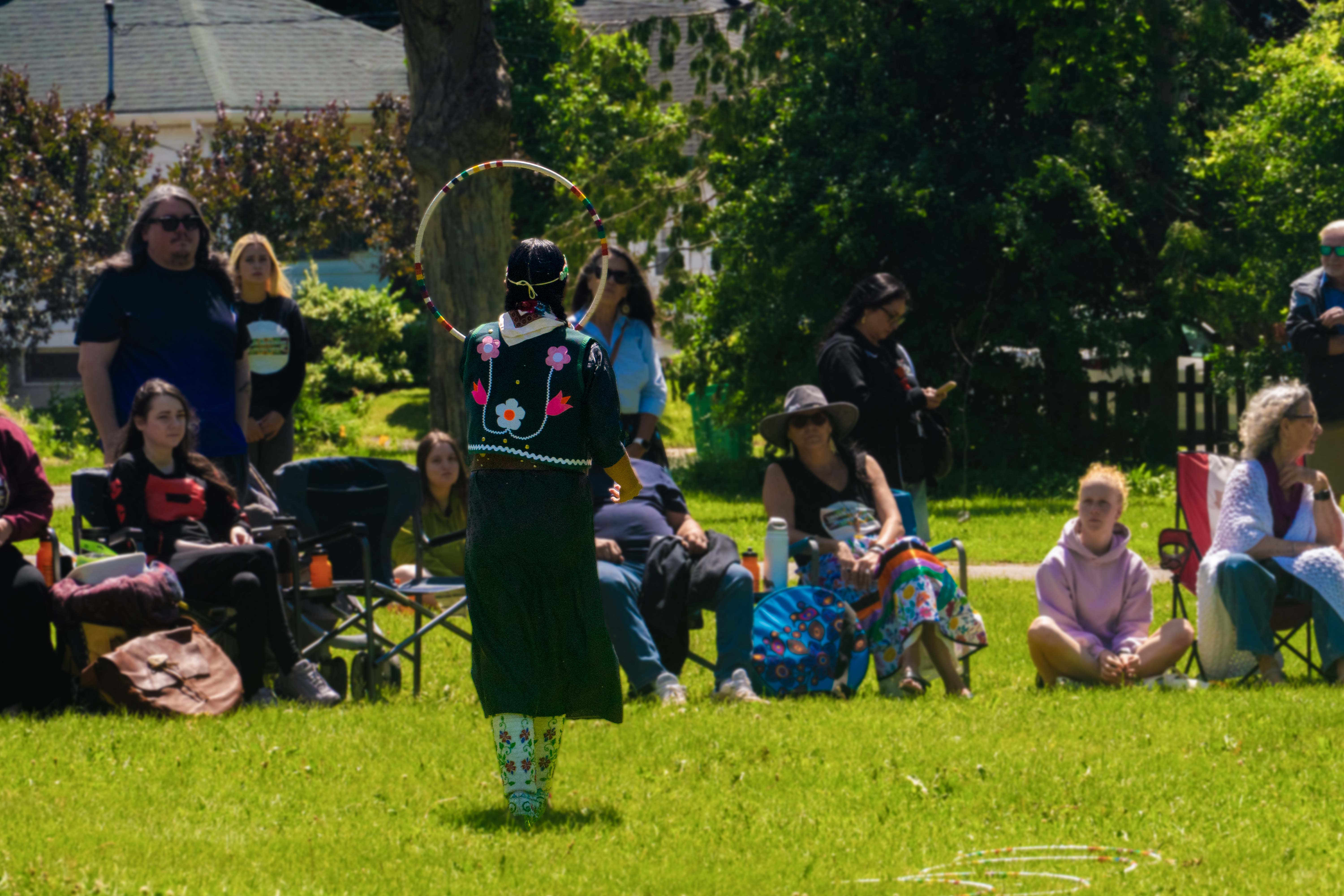 Indigenous participant performing with a hoop during National Indigenous Peoples Day